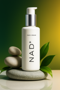 NAD+ skincare face cream bottle on stone with green leaves, symbolizing anti-aging and cellular rejuvenation in skincare.
