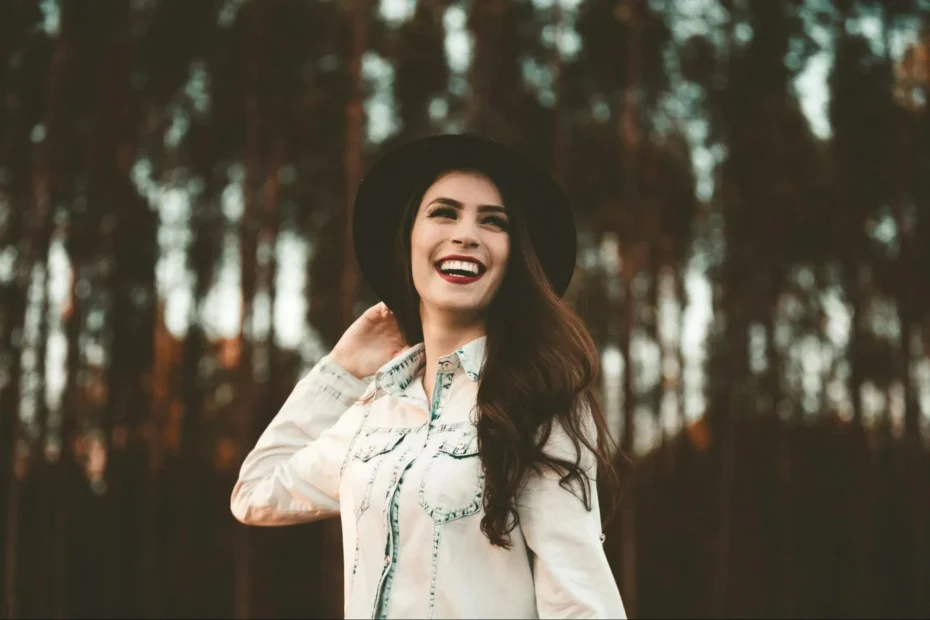 A smiling woman feeling healthy and confident from the positive results she gained using a peptide calculator for the best wellness plan.